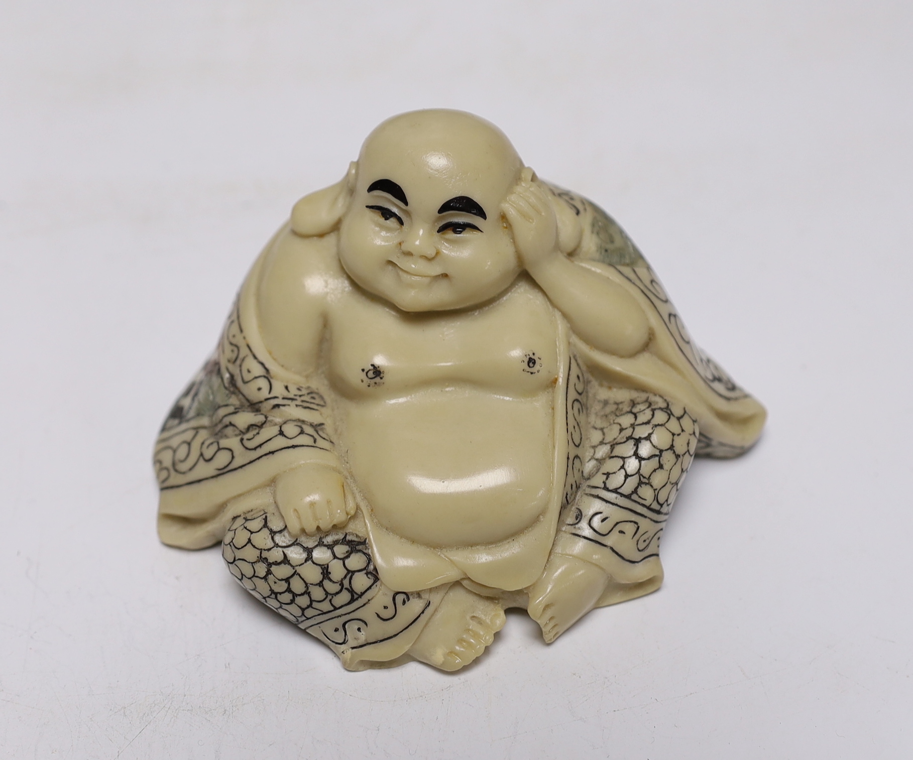Japanese and Chinese ceramics including blue and white bamboo plate, blanc de chine figures, and Buddha with erotic scene to the base, largest 42cm high
